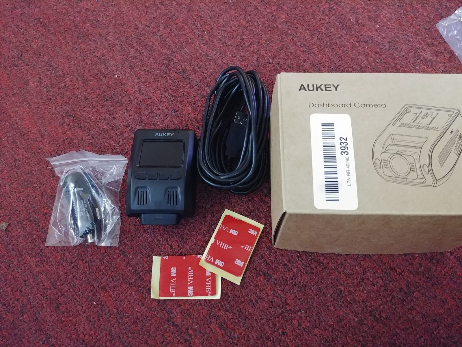 The Aukey dash cam and its box — parking recording ran off a small internal battery.
